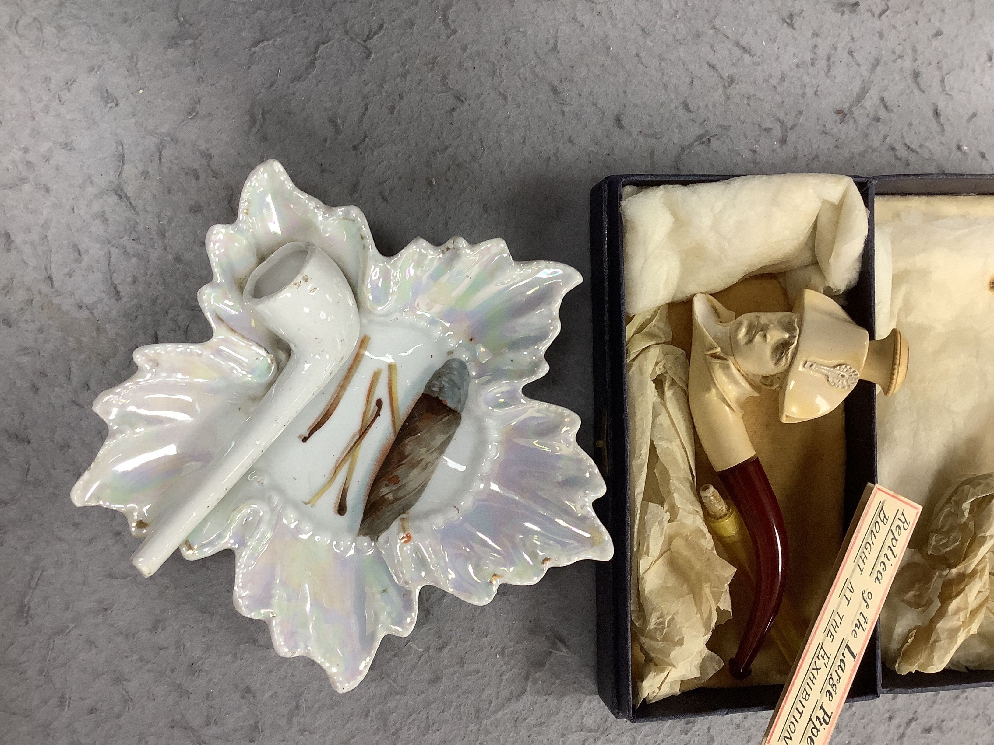 Ten mixed novelty pipes in various sizes with various mixed bowls, together with a small collection of mostly amber mouthpieces and other smoking related items, largest pipe 61cm long